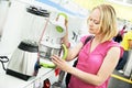 Woman shopping at home appliance supermarket