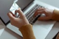 Woman shopping making Payment at Computer using Credit Card