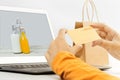 Woman shopping online sale holding gold credit card in a hand Royalty Free Stock Photo