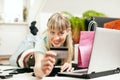 Woman shopping online via Internet from home Royalty Free Stock Photo