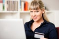 Woman shopping online via Internet from home Royalty Free Stock Photo