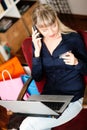 Woman shopping online via Internet from home Royalty Free Stock Photo