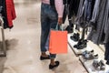 Woman shopping in a shopping center with bags