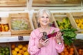 Woman shopping in small grocery store Royalty Free Stock Photo