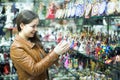 Woman shopping in souvenir store Royalty Free Stock Photo