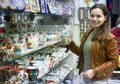 Woman shopping in souvenir store Royalty Free Stock Photo