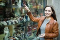 Woman shopping in souvenir store Royalty Free Stock Photo