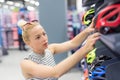 Woman shopping sports equipment in sportswear store. Royalty Free Stock Photo