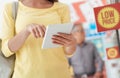 Woman shopping and using a tablet Royalty Free Stock Photo