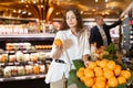 Woman shopping at vegetables department of supermarket Royalty Free Stock Photo