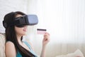 Woman shopping by VR headset Royalty Free Stock Photo