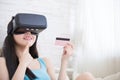 Woman shopping by VR headset Royalty Free Stock Photo