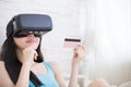 Woman shopping by VR headset Royalty Free Stock Photo