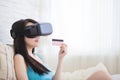 Woman shopping by VR headset Royalty Free Stock Photo