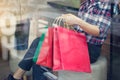 Woman with shoppingbags in hand relaxing in shop of mall Royalty Free Stock Photo