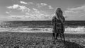 Woman on shore of Aegean Sea. Carian Trail, Turkey. Serenity, tranquility, solitude. Black and white.