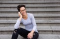 Woman with short hair and glasses talking on mobile phone