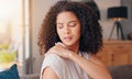 Woman, shoulder pain and injury in home with stress, thinking and hand for massage for relief. Girl, person and burnout Royalty Free Stock Photo