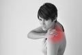 Woman with shoulder pain or stiffness