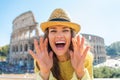 Woman shouting through megaphone shaped hands Royalty Free Stock Photo