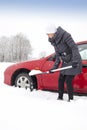 Woman shovelling and removing snow Royalty Free Stock Photo