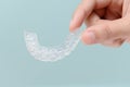 Woman show orthodontic silicone trainer. Royalty Free Stock Photo