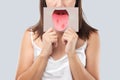 The woman show the picture of tongue problems Royalty Free Stock Photo
