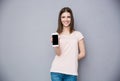 Woman showing blank smartphone screen Royalty Free Stock Photo