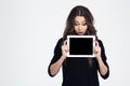 Woman showing blank tablet computer screen Royalty Free Stock Photo