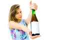 A woman showing bottle of red sparkling wine with blank etiquette Royalty Free Stock Photo