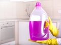 Woman showing cleaning product