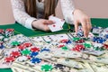 Woman showing combination of two aces and making bet Royalty Free Stock Photo