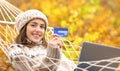 Woman showing credit card on winter holiday Royalty Free Stock Photo