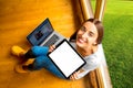 Woman showing digital tablet in the wooden house Royalty Free Stock Photo