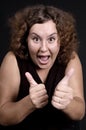 Woman showing double thumbs up