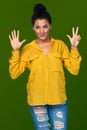 Woman showing eight fingers Royalty Free Stock Photo