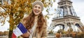 Woman showing flag on embankment near Eiffel tower, Paris Royalty Free Stock Photo