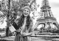 Woman showing flag on embankment near Eiffel tower, Paris Royalty Free Stock Photo