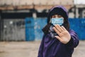 Woman showing gesture stop. Woman wears protective mask against infectious diseases and flu. Health care concept. Coronavirus Royalty Free Stock Photo