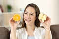 Woman showing half apple and half orange