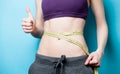 Woman showing her abs with metric Royalty Free Stock Photo