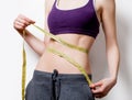 Woman showing her abs with metric Royalty Free Stock Photo