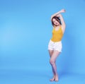 Woman showing her armpit clean clear depilation while standing on blue background. Perfect skin armpit Royalty Free Stock Photo