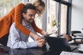 Woman showing her sketches to her male colleague Royalty Free Stock Photo