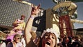 A woman showing her tongue at a music festival