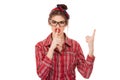 Woman showing hush sign gesture with one hand and attention listen to me with other hand