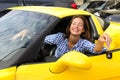 Woman showing keys of her new sports car Royalty Free Stock Photo