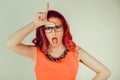 Woman showing loser sign wears glasses Royalty Free Stock Photo