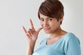 Woman showing love hand sign Royalty Free Stock Photo