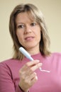 Woman showing menstrual applicator Royalty Free Stock Photo